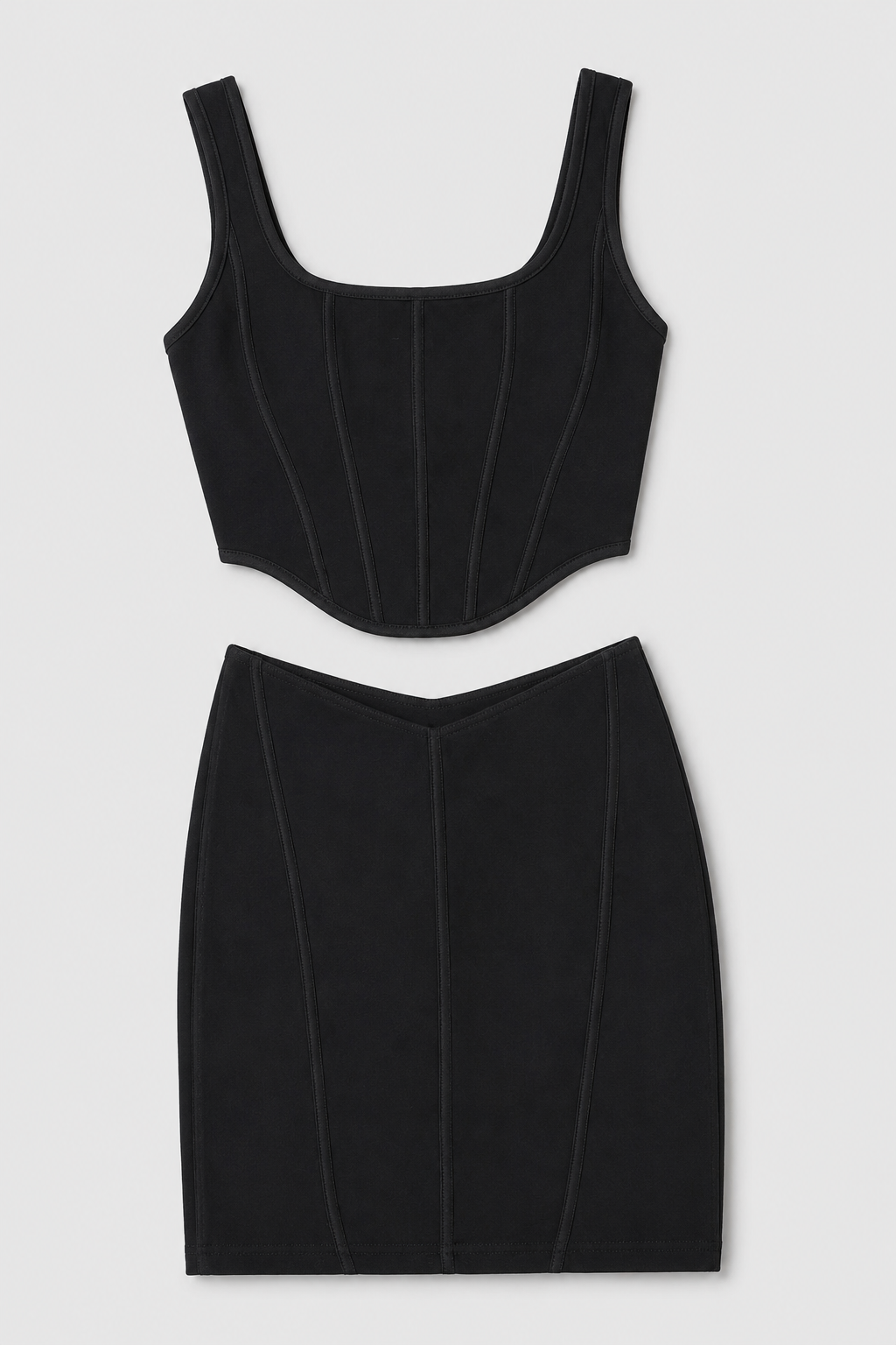 Black sleeveless top and pencil skirt set on a light gray background