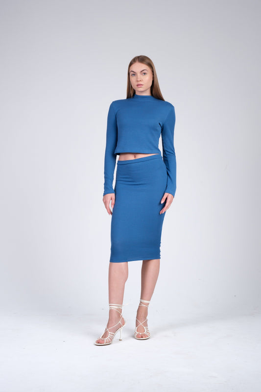 Model in a ribbed blue skirt set