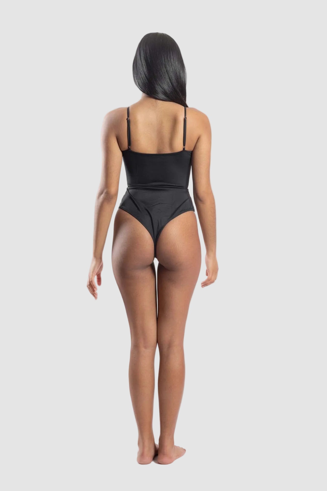 Back view of women’s sustainable one-piece swimsuit in black