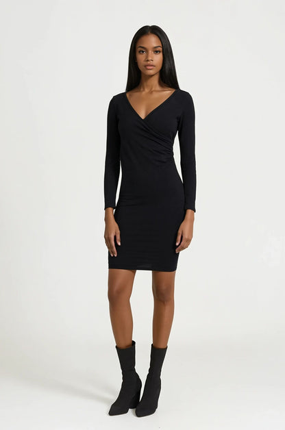 Model in black wrap dress