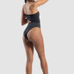 Woman wearing a black swimsuit on a white background