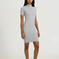 Woman wearing a gray dress on a white background