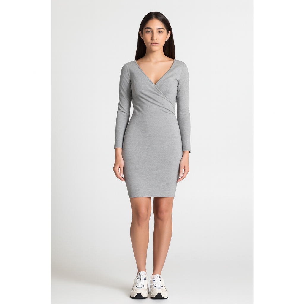 Woman wearing a gray long-sleeve dress on a white background