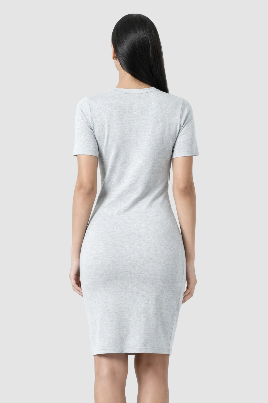 Woman wearing a gray dress on a white background