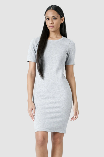 Woman wearing a gray t-shirt dress on a white background
