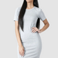 Woman wearing a gray t-shirt dress on a white background