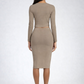 Woman wearing an olive long-sleeve top and skirt set on a white background