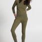 Model in olive green cotton sweatpants for women with matching sweatshirt