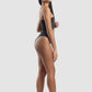 Woman wearing a black swimsuit on a white background