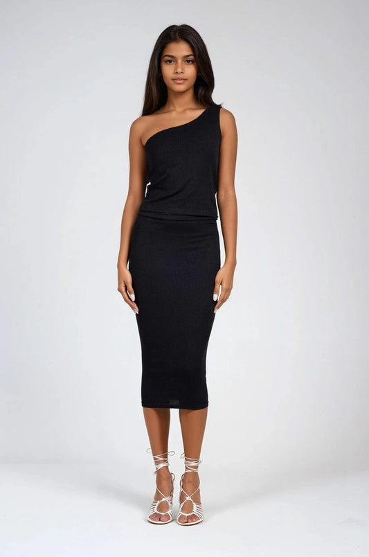 Model in ribbed one shoulder top with matching skirt in black