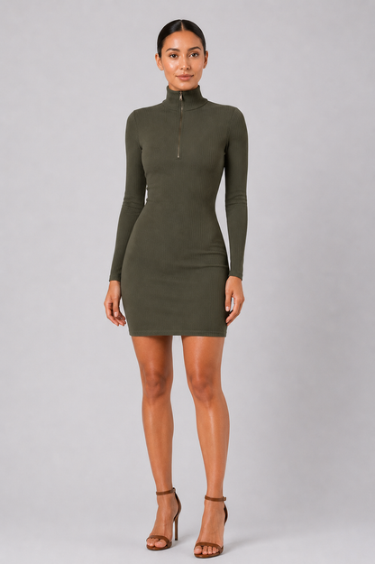 Woman wearing a green dress against a gray background
