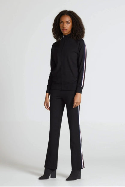 Person wearing a black outfit with white stripes on a white background