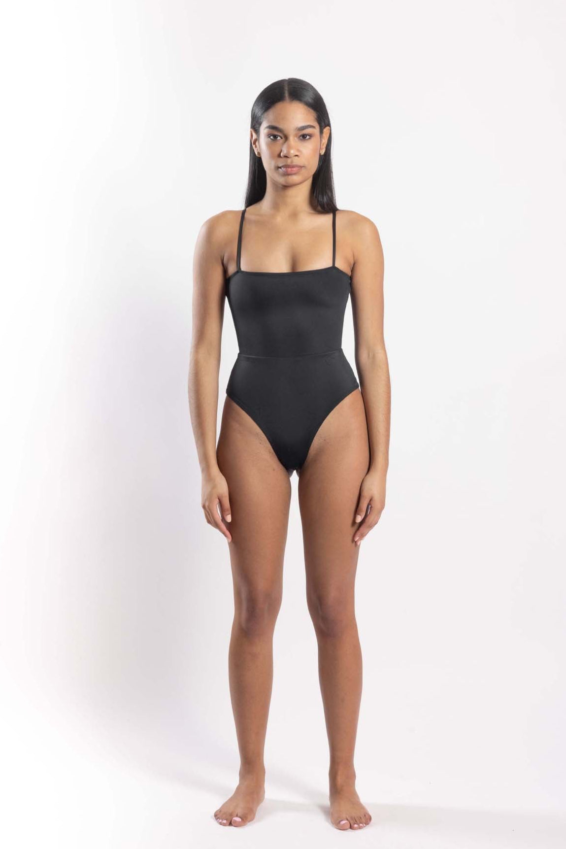 Women’s sustainable one-piece swimsuit with adjustable straps in black - front view