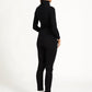 Model back view of black zip top outfit against a white background.