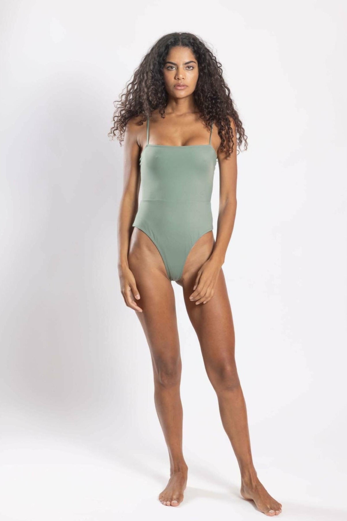 Women’s sustainable one-piece swimsuit with adjustable straps in sage – front view